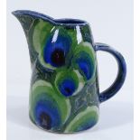 A Dart Pottery peacock design jug, by Clare Woodhall and Janice Tchalenko, height 18cm