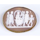 A relief carved cameo shell brooch, depicting Classical cherubs and faun, in gilt-metal rope twist