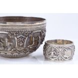 A Burmese silver bowl with relief figure decoration, 11cm diameter, together with a similar design