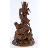A 19th century Black Forest carved wood vase, with mountain goat designs, height 27cm