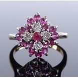 A 9ct gold ruby and diamond cluster ring, setting height 13.4mm, size J, 3g