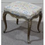 A carved giltwood framed dressing stool, circa 1900, with upholstered seat and cabriole legs