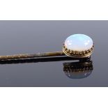 An unmarked gold cabochon opal stickpin, opal measures 9mm x 6.6mm x 3.6mm, 1.3g