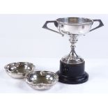 A silver 2-handles trophy on pedestal, together with 2 silver pin trays, by Wilson & Gill (3)