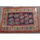 A small blue ground Turkish wool rug, with allover flower design, 4'4" x 3'2"