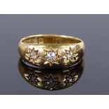 An 18ct gold 3-stone diamond gypsy ring, hallmarks Birmingham 1916, setting height 6.8mm, size K,