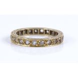 An 18ct gold paste set eternity ring, band width 2.9mm, size L, 3.1g
