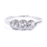 An unmarked white gold 3-stone diamond ring, settings test as 18ct gold, setting height 5.1mm,
