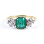 An 18ct gold 3-stone emerald and diamond ring, diamonds approx 0.5cts each, emerald measures 6.8mm x
