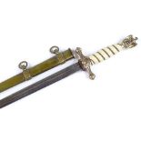A German Naval dagger, etched blade with maker's marks WKC, engraved brass scabbard