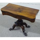 A 19th century mahogany fold over card table on carved quadruple base, width 3'
