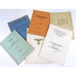 A group of German Kriegsmarine Naval School manuals, and Eagle Order citation