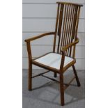 An Art Nouveau beech-framed comb-back chair, with marquetry inlaid splat