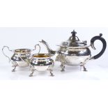 A circular silver 3-piece tea set, with fluted edges and gilded linings, by C S Harris & Sons Ltd,