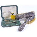 An Art Deco silver baby's spoon and pusher set, by Goldsmiths & Silversmiths Co, a silver and yellow