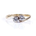 A 9ct gold 2-stone diamond crossover ring, total diamond content approx 0.3cts, maker's marks JM Co,