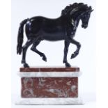 A 19th century bronze patinated metal sculpture of a horse, unsigned on two-colour marble base,