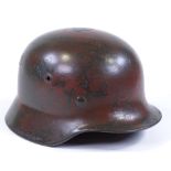 A German Luftwaffe camouflage helmet with decals