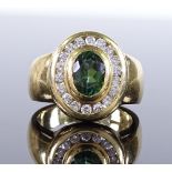 A Charles Greig 18ct gold green-stone and diamond cluster ring, green stone possibly chrysoprase,