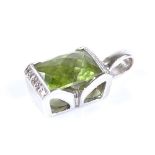 An 18ct white gold faceted peridot and diamond pendant, with openwork back, overall height 18.3mm,