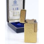 A Dunhill gold plated pocket lighter, boxed