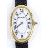 An 18ct gold Bueche-Girod oval Cartier style wristwatch, with warped oval dial and sapphire crown,