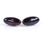 A pair of oval cabochon garnet stud earrings, unmarked gold settings, height 18.4mm, 4.3g