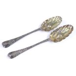 A pair of Queen Anne Britannia silver berry spoons, dates of London 1704 and 1713?, 1 possibly by