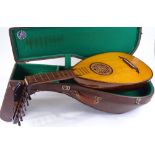 A Perl-Gold lute, with carrying case