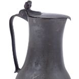 An Antique Channel Islands pewter lidded flagon, with acorn thumb piece, maker's marks IDSX