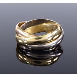 An 18ct gold Cartier Trinity ring, in 3-tone gold bands, 1 ring signed Les Must de Cartier, model