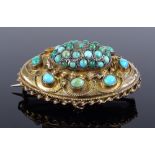 A 15ct turquoise oval brooch, length 33.8mm, 10.9g (2 stones missing)