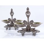 A pair of 19th century cast French silver Rococo style table salts, with gilt shell design bowls and