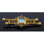 An Edwardian unmarked gold cabochon opal brooch, settings probably 18ct gold, length 51.6mm, 7.5g
