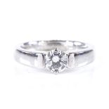 A 0.55ct solitaire diamond ring, 18ct white gold settings, diamond in prong and channel setting,