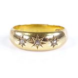 An 18ct gold 3-stone diamond gypsy ring, maker's marks JG, hallmarks Chester 1903, band width 6.7mm,