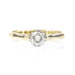 An 18ct gold solitaire diamond ring, diamond approx 0.2ct, with platinum claws, maker's marks HS,