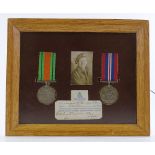 A framed pair of Second War Service medals, awarded to 1741521 Gnr G E Keily RA