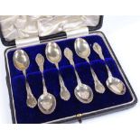 A cased set of 6 sterling silver teaspoons, with foliate borders, imported by Gorham Manufacturing