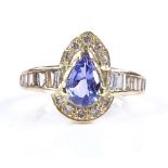 An 18ct gold pear-cut tanzanite and diamond cluster ring, with graduated tapered baguette-cut