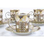 A set of 4 Aynsley gilded china coffee cups and saucers, in silver holders