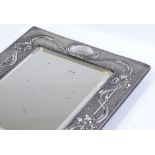 A large Art Nouveau silver-fronted rectangular mirror, with relief embossed tulip border, by A&J