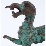 A verdigris cast-iron ornamental dragon, length 24cm, height 24cm