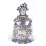 A Continental silver hand bell, with relief embossed foliate decoration, height 10cm