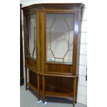 An unusual Edwardian mahogany tapered-front 2-door display cabinet, with inlaid satinwood banding