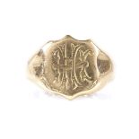 An Edwardian 18ct gold shield-shaped signet ring, hallmarks Chester 1903, panel height 13.9mm,