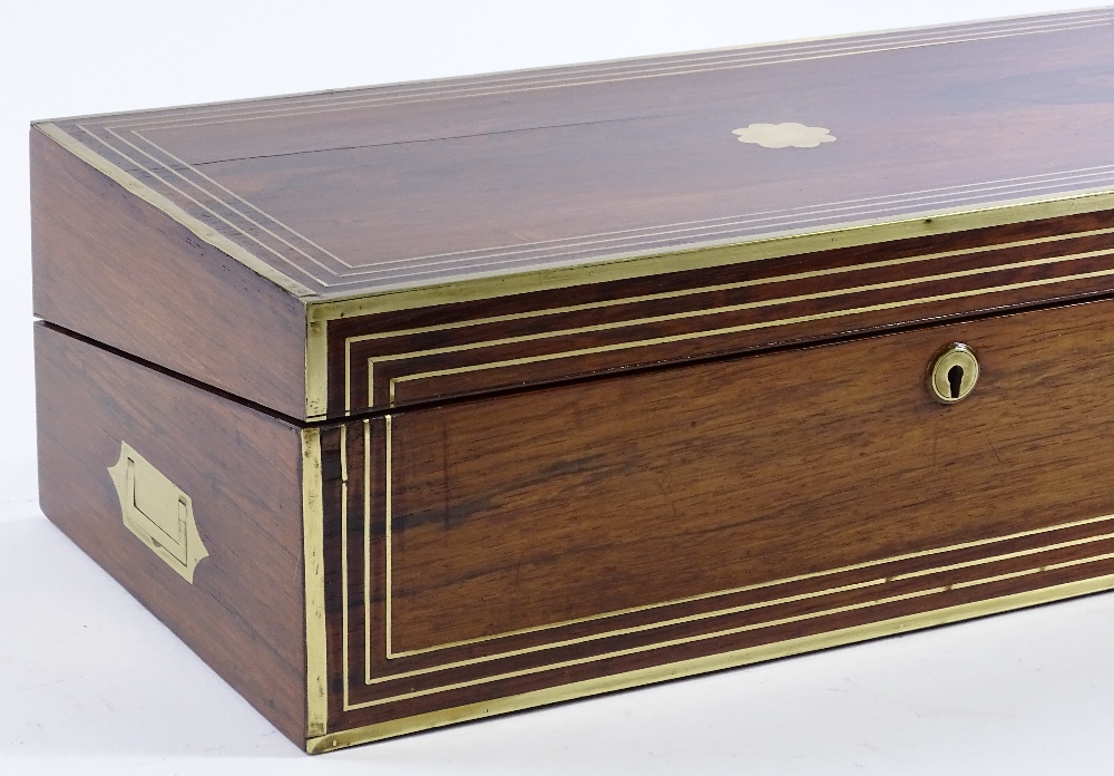 A 19th century brass-bound rosewood writing slope, with inlaid brass stringing, recessed brass