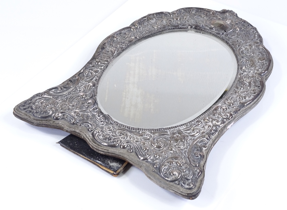 An Edwardian silver-fronted photo frame, with all over relief embossed foliate and scrollwork - Image 2 of 3