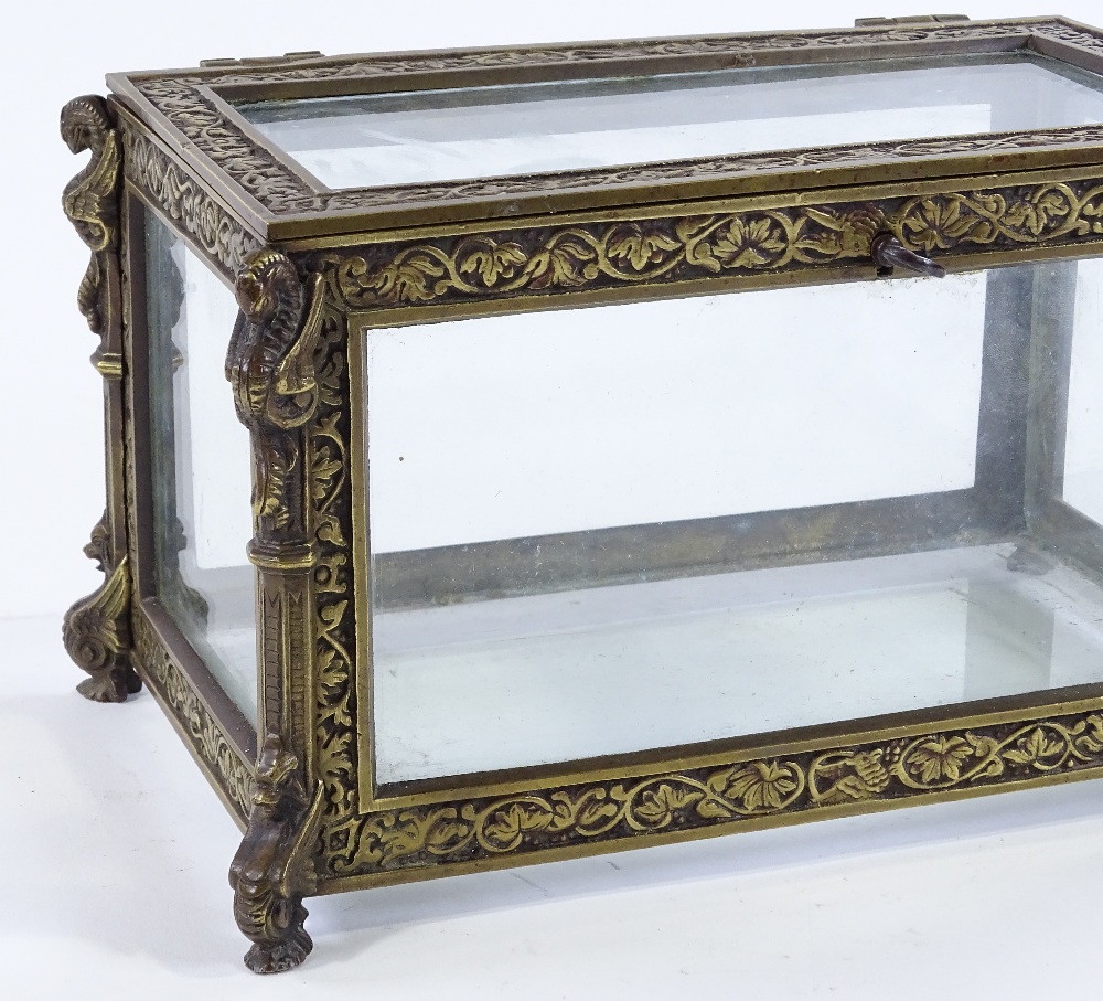 A Victorian cast-brass framed casket, with relief moulded decoration and glass panels, width 22cm