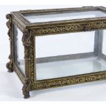 A Victorian cast-brass framed casket, with relief moulded decoration and glass panels, width 22cm